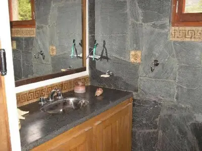 a bathroom with a sink and a mirror at Casa Monte in Villa Icho Cruz