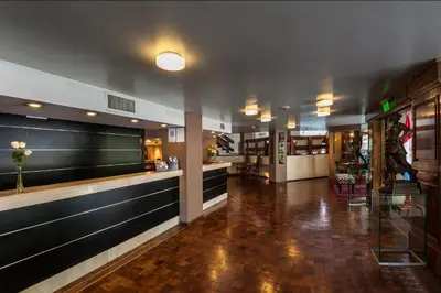 a lobby of a restaurant with a bar at Hotel de la Cañada in Cordoba