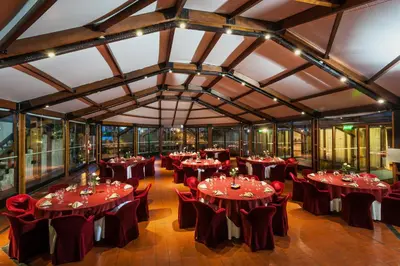 a large room with tables and chairs in it at Hotel de la Cañada in Cordoba