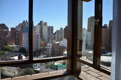 a view of a city from an open window at Hotel de la Cañada in Cordoba