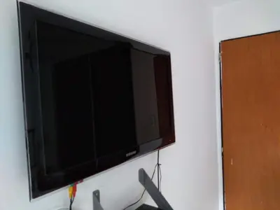 a flat screen television hanging on a wall at Departamento Alberdi in Cordoba