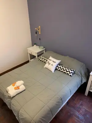 a bed in a room with two pillows on it at Torre Magna II, Nueva Cordoba in Cordoba
