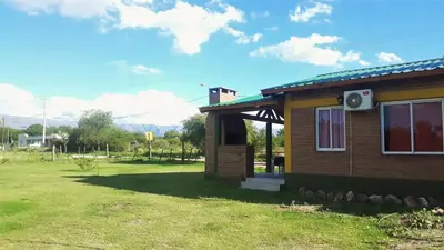 a small house with a speaker on the side of it at Luz Alba Cabañas in Mina Clavero