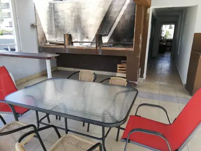 a black table and chairs in a room at VICTORIA PARK in Villa Carlos Paz