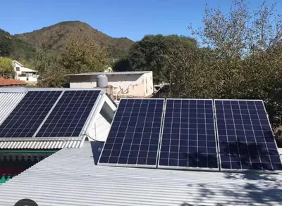a group of solar panels on the roof of a house at Dpto La Bicicleta solar in Villa Independencia