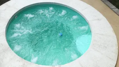 a swimming pool with a blue ball in the water at Dpto La Bicicleta solar in Villa Independencia