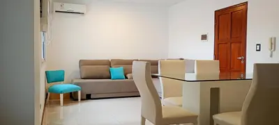 a living room with a couch and a table and chairs at Departamento centrico carlos paz in Villa Carlos Paz