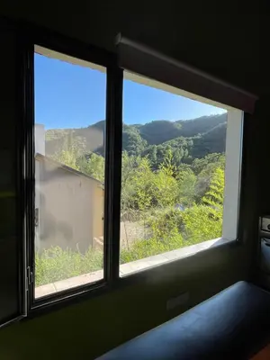 a window in a room with a view at Casas Pura Vida in Villa General Belgrano