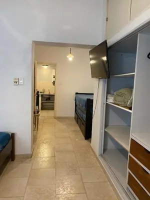 a small room with a kitchen and a hallway at Departamento Hospital Privado Quality maternidad Con cochera in Cordoba
