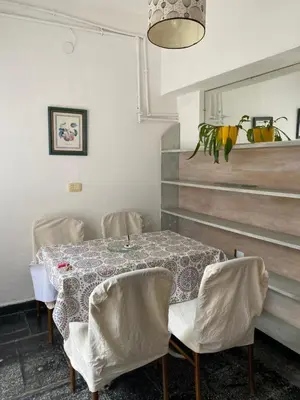 a dining room with a table and chairs at Departamento Hospital Privado Quality maternidad Con cochera in Cordoba