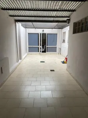 an empty room with a tiled floor in a building at Departamento Hospital Privado Quality maternidad Con cochera in Cordoba