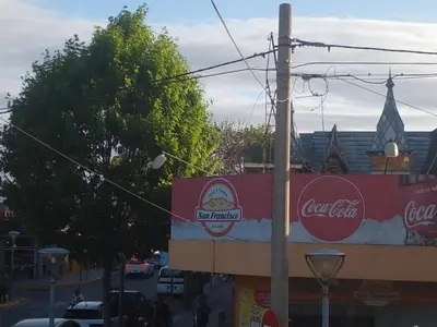 a building with cocacola signs on the side of it at Luminoso y bello departamento en Carlos Paz in Villa Carlos Paz