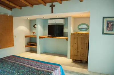 a bedroom with a bed and a tv in a room at Casa Villa in Cordoba