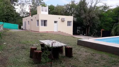 a house with a pool in front of it at Casa con pileta privada in Tanti