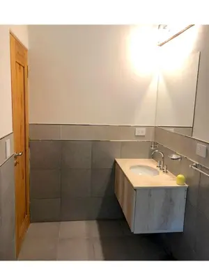 a bathroom with a sink and a mirror at Complejo Verde Memoria in Merlo