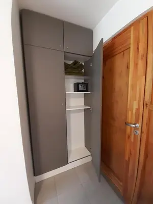a walk in closet with a door next to a room at Complejo Verde Memoria in Merlo