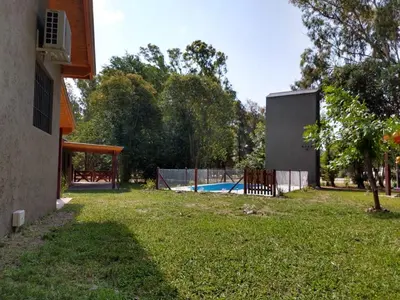 a view of a yard with a pool at Complejo El Bosque in Villa Ciudad Parque