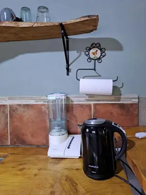 a blender sitting on top of a wooden table at Surya- en La Casa de Nanda in San Javier
