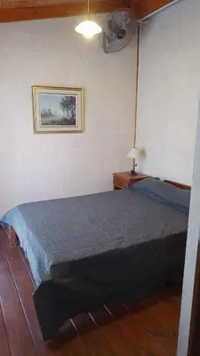 a bedroom with a large bed in a room at Campos de Dios in Potrero de Garay