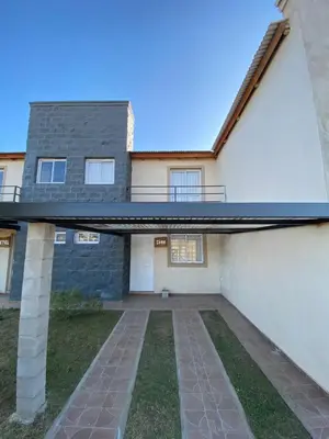 a house with a walkway in front of it at Campos de Dios in Potrero de Garay