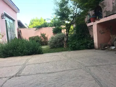 an empty driveway in front of a house at Gimenoz Apart in Nono