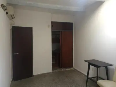 an empty room with a door and a table at Gimenoz Apart in Nono