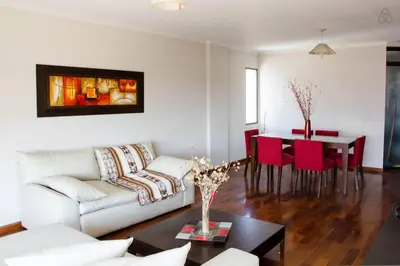 a living room with a couch and a table at Departamento enorme sobre Cañada Patio Olmos in Cordoba