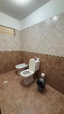 a bathroom with a toilet and a bidet at Ariel Reynoso - Departamento Planta Baja in Mina Clavero