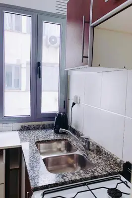 a kitchen with a sink and a counter top at Ayres de Córdoba, Gran Terraza, Excelente Ubicación in Cordoba