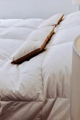 a white bed with a pillow on it at Ayres de Córdoba, Gran Terraza, Excelente Ubicación in Cordoba