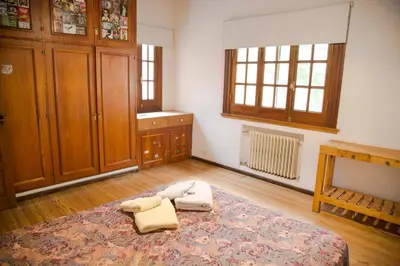 a bedroom with a bed with two towels on it at Casa en Córdoba in Cordoba