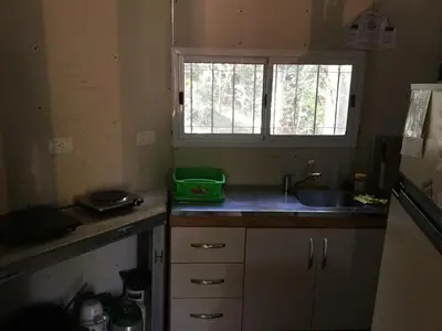 a kitchen with a sink and a window at Las zarinas 1 in Trapiche