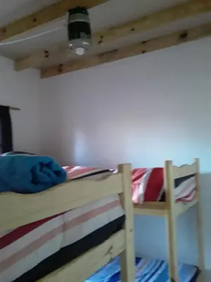 two bunk beds in a room with a ceiling at Las zarinas 2 in Trapiche