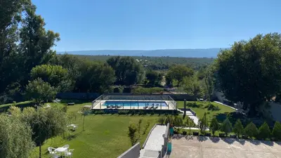 an aerial view of a building in a park at Hotel Las Piedras in Villa Cura Brochero