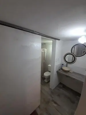 a bathroom with a toilet and a sink at El mirador de estrellas in Santa Rosa de Calamuchita