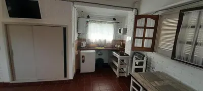a small kitchen with a sink and a counter at El mirador de estrellas in Santa Rosa de Calamuchita
