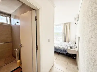 a room with a bedroom with a bed and a window at Stefano IV in Villa Carlos Paz