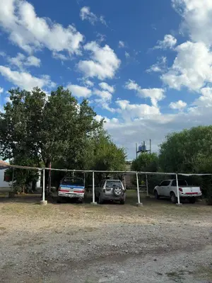 a group of cars parked in a parking lot at El Roble in Merlo
