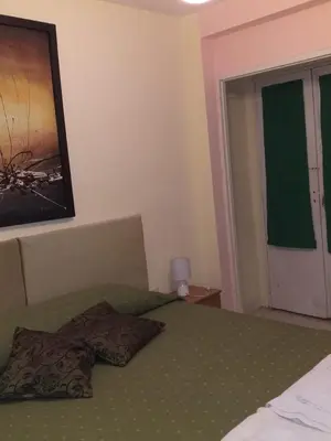 a bedroom with a bed with two pillows on it at MT Verde Barrio Jardín in Cordoba
