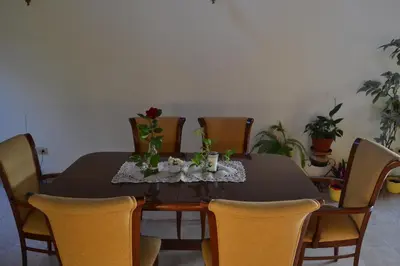 a dining room table with chairs and a black table cloth at Casa de las 3 chimeneas in Cordoba