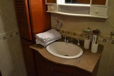 a bathroom sink with towels on top of it at Casa de las 3 chimeneas in Cordoba