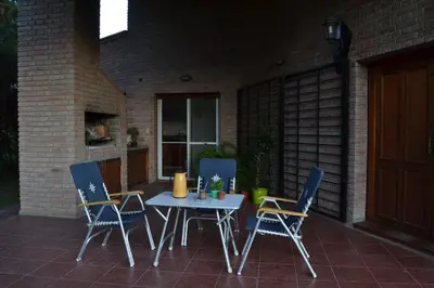 a table and four chairs on a patio at Casa de las 3 chimeneas in Cordoba
