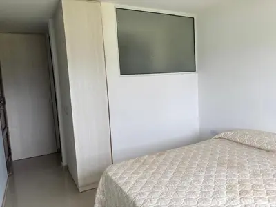 a bedroom with a bed and a window on the wall at casa del alto categoria vista plena lago pileta in Villa Carlos Paz