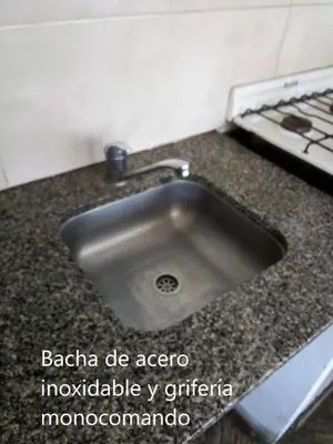 a stainless steel sink in a kitchen with a stove at Amplio 2 Dormitorios en Cofico in Cordoba