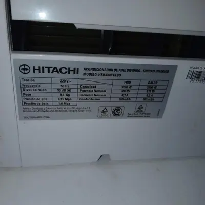 a close up of a microwave with a sign on it at Amplio 2 Dormitorios en Cofico in Cordoba