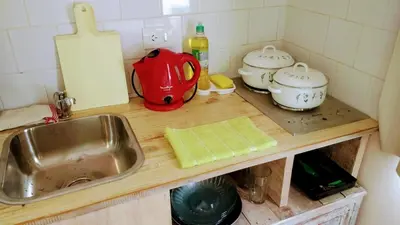 a kitchen counter with a sink and pots and pans at apartamento VINTAGE LU in Merlo