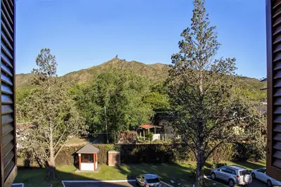 a view of a mountain from a building at Hotel Edelweiss in Villa General Belgrano