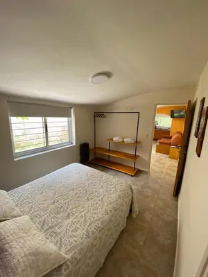 a bedroom with a large bed and a window at Rincón Sereno in Villa General Belgrano