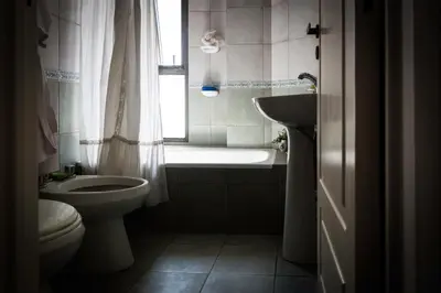 a bathroom with a toilet and a tub and a sink at Las Tejas in Cordoba