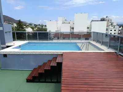 a swimming pool on the roof of a building at Departamento Entre Rios in Villa Carlos Paz